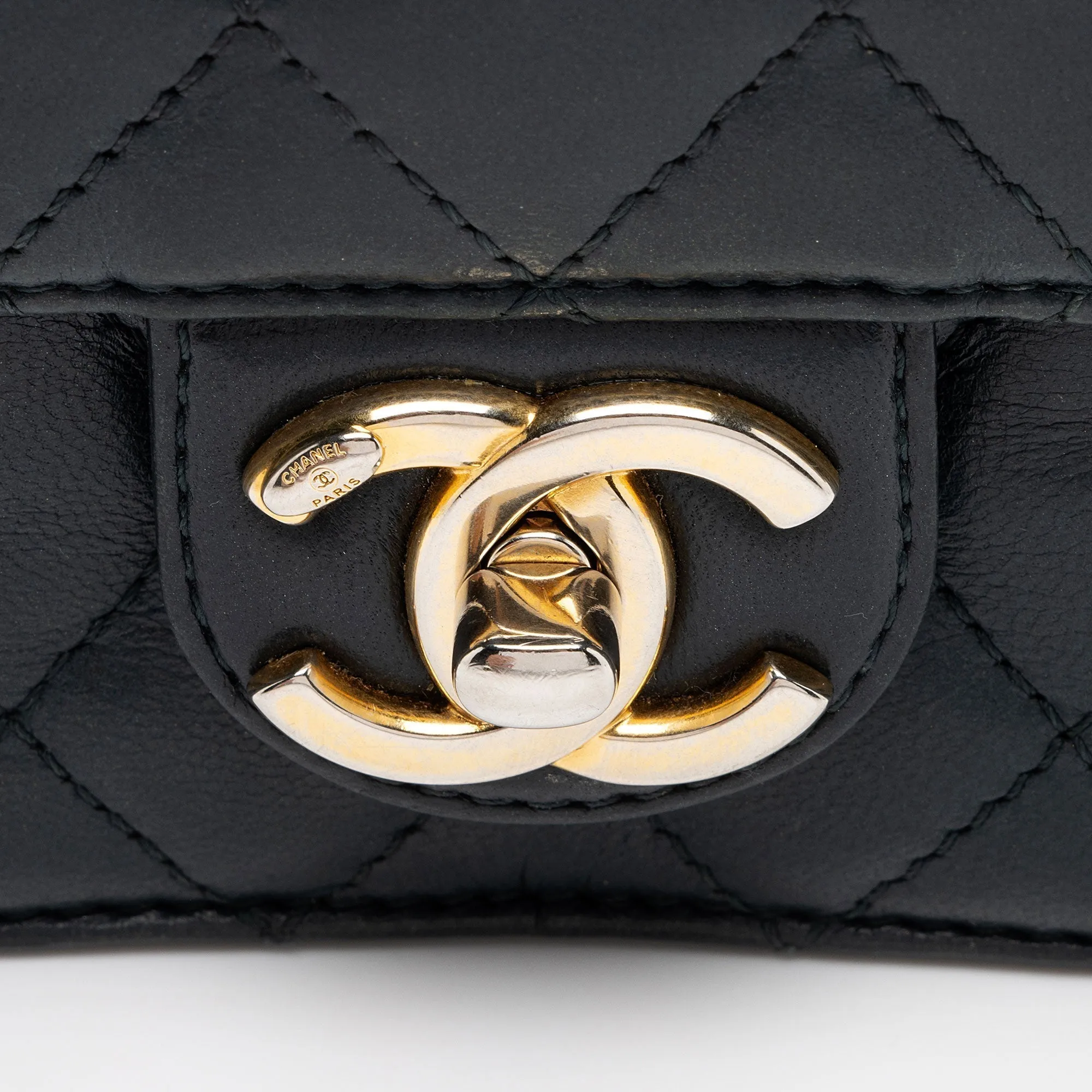 Chanel Lambskin Crossing Times Mini Flap Bag (SHF-Tv2M1K)